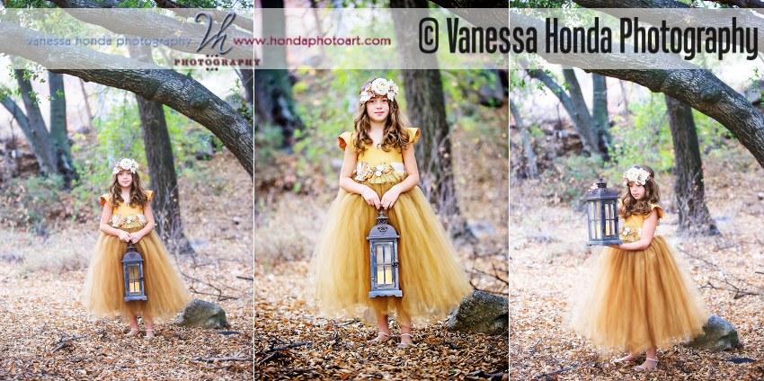 Girl in golden dress poses with lantern in the woods
